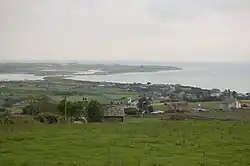 Llandanwg viewed from above the main road with Mochras (Shell Island) in the background