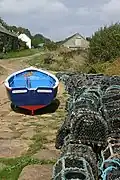 A boat and lobster pots at Penberth Cove