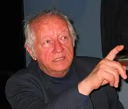 Photo of Lojze Lebič. He appears to be discussing something and is mid-gesture