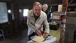 The Lord Mayor of the City of Adelaide, Martin Haese, signs the Visitor book inside the historic clipper ship City of Adelaide.