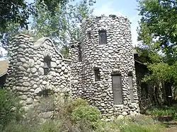 View of the stone facade with the bell.