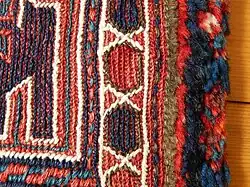 Detail of edge with narrow strip of pile carpet (right)
