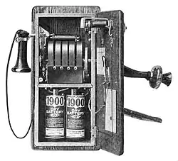 Image 31917 wall telephone, open to show magneto and local battery (from History of the telephone)