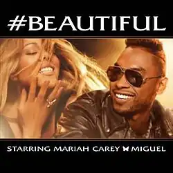 a horizontal image shows Mariah Carey on the left and Miguel on the right. Mariah Carey is seen from the chest up, with her eyes closed and a wide smile, her blonde hair flowing. She is wearing a ring on her left hand, which is gently touching her face. Miguel, positioned to the right of Mariah, is shown from the chest up, smiling and wearing sunglasses. He is wearing a dark leather jacket. The background behind both artists appears to be blurred with warm, bright lights.
