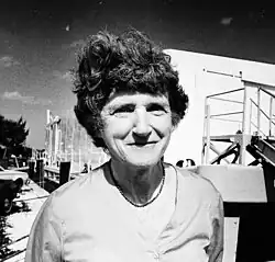 Woman standing in front of Smithsonian Marine Station's floating lab at Link Port
