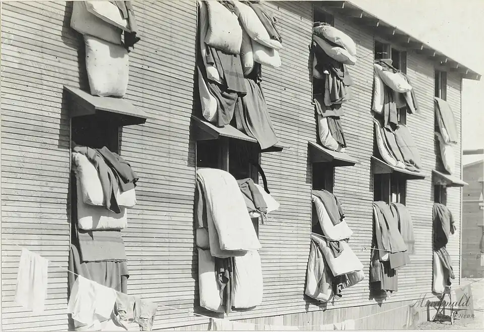 "Beds airing, Camp Funston, Kansas", in 1917 or 1918