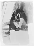 Two men, Walter Airey and Bob Horton, kissing on board the yacht Tawera c. 1900
