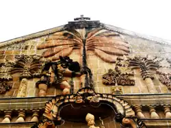 Pediment featuring St. Christopher carrying Child Jesus on his back