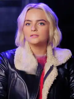 Ruby Sunday, a young woman with dyed blond hair and green eyes, wearing a leather wool jacket.