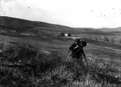 Milton Manaki filming with Bioscope Camera 300 in a valley