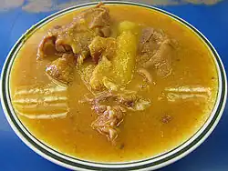 brownish soup with unidentified bits of meat in it