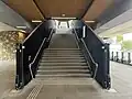 The stairs leading up to the station platforms from the main concourse, October 2024