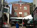 The Offices and Rectory of the Most Precious Blood Church, during the San Gennaro Festival, featuring a shrine to San Gennaro on the left