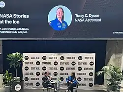 Two people having public event conversation