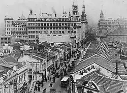 Nanjing Road in Shanghai, within the Shanghai International Settlement, a concession administered by multiple foreign powers during the late Qing Dynasty.