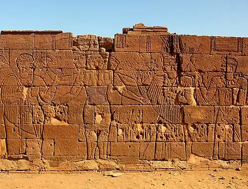 Three-headed Apedemak with four arms