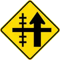 Railway level crossing on side road to left