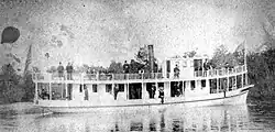 Steamboat Walkatomica loaded with passengers running on the waterway (1885)