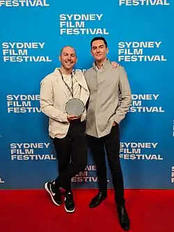 Nick Lacey at the 2024 Sydney Film Festival receiving the Dendy Live Action Short Award