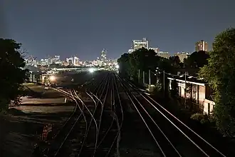 A nighttime CSX train services the loading tracks in 2024
