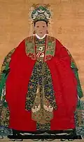 Ming dynasty noblewomen wearing a green embroidered xiapei over her red robe.