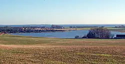 Norsminde Fjord viewed towards the Bay of Aarhus, with the village of Norsminde at the seaside.