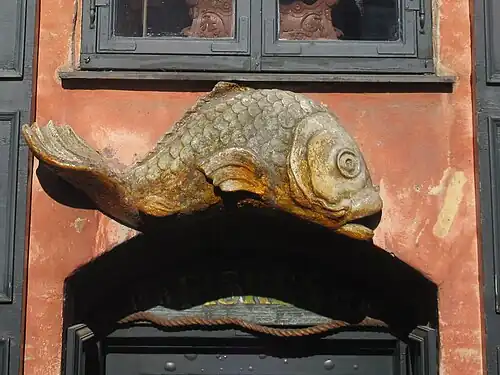 The fish relief above the basement entrance