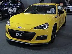 Subaru BRZ tS, a high-performance variant of the standard Subaru BRZ coupe. This photo shows the front of the car, which is yellow with a small "STI" emblem on the front grille.