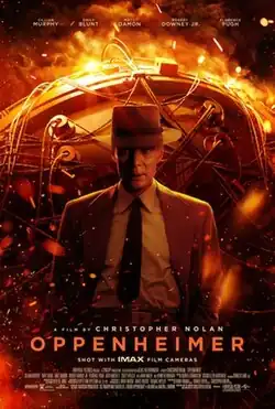 Film poster showing J Robert Oppenheimer (Murphy) standing behind the "Gadget" nuclear bomb.