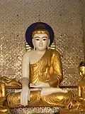 Burmese style Buddha, Shwedagon pagoda, Yangon.