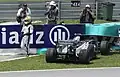 Pastor Maldonado exiting car after his crash during Malaysian Grand Prix practice session, 8 April 2011