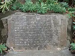 Dedication plaque for the flag pole.