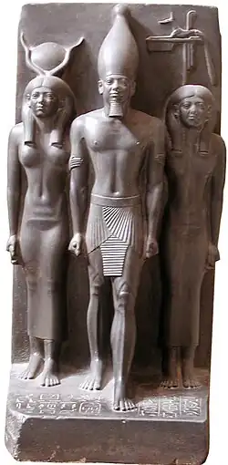 Menkaure alongside Hathor and the nome goddess Anput