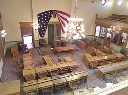 A view from the fourth floor of the Arizona State Capitol Museum looking down from the gallery into the original House Chamber.