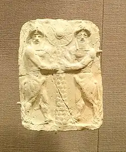 Plaque with bull-men holding a palm trunk with sun disk, Ishchali, Isin-Larsa to Old Babylonian, 2000–1600 BC, baked clay - Oriental Institute Museum, University of Chicago