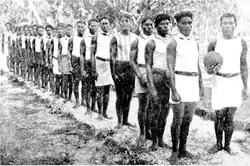 Police team lining up for a football match at Nauru in 1916. The game there received continued support from Australia.