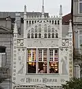 The detail of the Lello bookstore pinnacles and stained-glass windows
