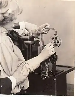 Triple-column film being threaded through the Home Projecting Kinetoscope, 1912