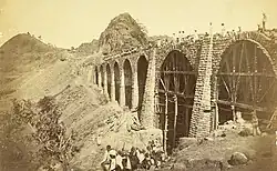 Photograph (1855) showing the construction of the Bhor Ghaut incline bridge, Bombay; the incline was conceived by George Clark, the Chief Engineer in the East India Company's Government of Bombay.