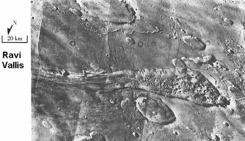 Ravi Vallis, as seen by Viking Orbiter. Ravi Vallis was probably formed when catastrophic floods came out of the ground to the right (chaotic terrain). Image located in Margaritifer Sinus quadrangle.