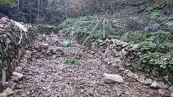 Repairing Keiryū-style wasabi fields. The fields are mostly located in places heavy machinery cannot access, so farmers usually maintain the fields by hand.