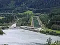 Rottau equalizing basin. Right: the Oberwasser channel, that leads to Möll Valley Power Station. Left: the natural river bed though which only a fraction of the water flows.