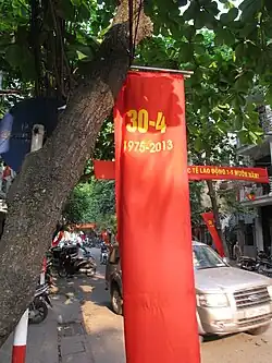A red banner with the yellow words 30-4, and 1975-2013 under it.