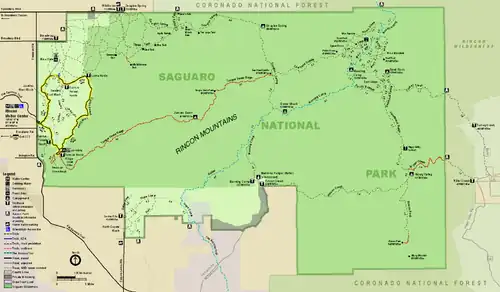 Map of the Rincon Mountain District, an irregular retangle, wider than long, colored green, and surrounded by areas colored brown or light purple that are outside the park