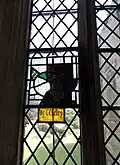Medieval glass fragment to Sir John Welby in the south aisle east window