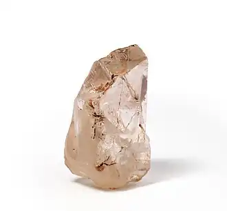 An irregular shaped brownish diamond