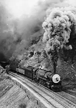 500 class engine No.502 hauling a freight train in at Eden Hills, August 1953.