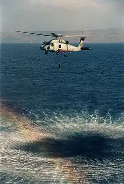 U.S. Navy SH-60F helicopter with AQS-13F transducer deployed