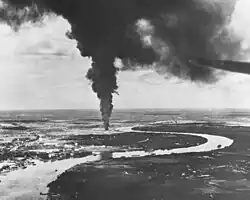 Saigon afire after aerial attacks from carrier-based planes of the US Pacific Fleet in 1945.