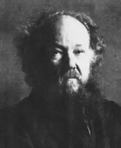 elderly white man with shaggy beard and receding hair